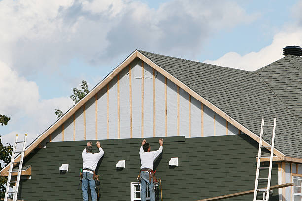 Professional Siding Installation technician working in Brightwaters, NY